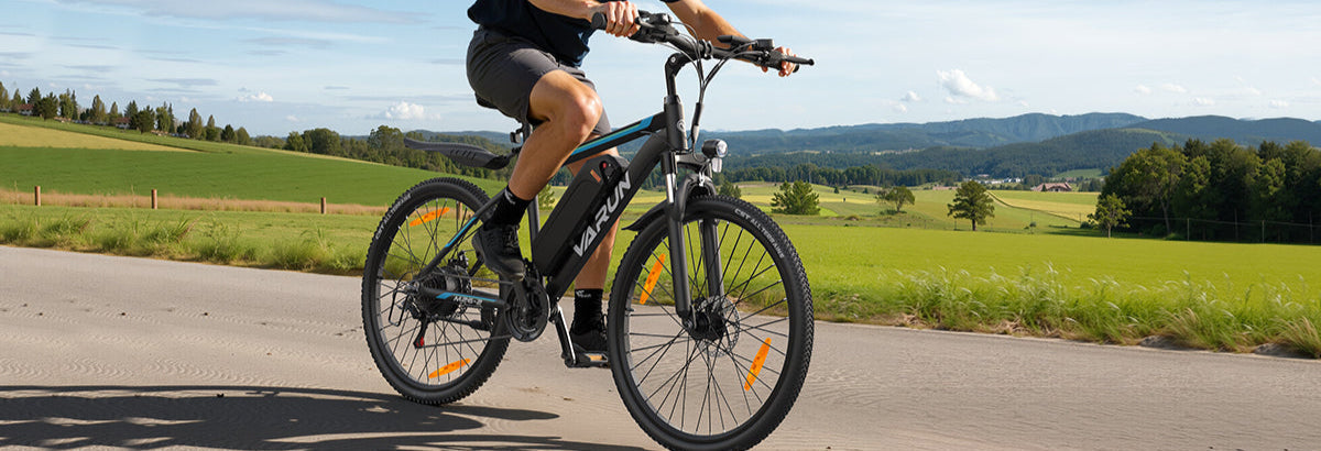 Man riding E-bike M26-2 on a road